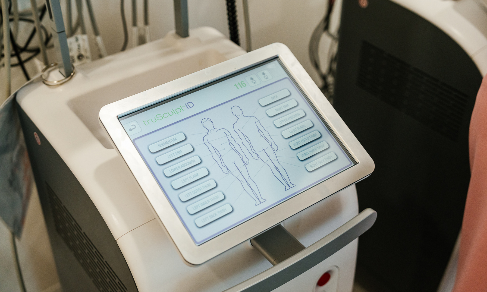 Non-invasive body treatment shown in a medical weight loss setting