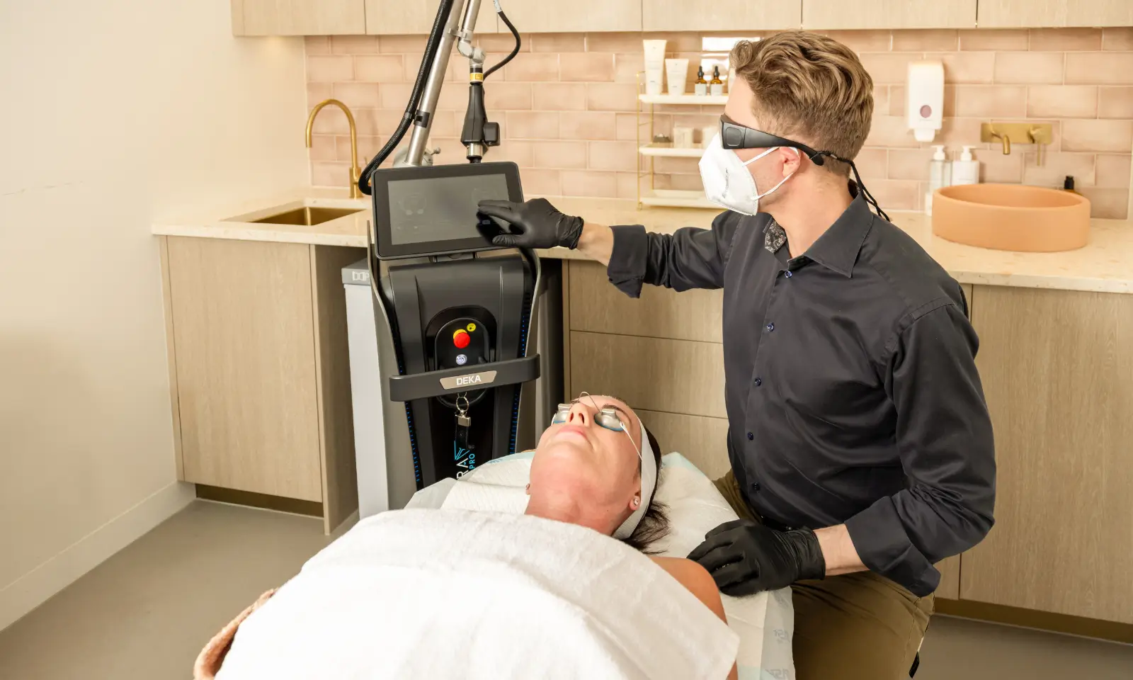 Clinician using a laser device for Fraxel vs CO2 education